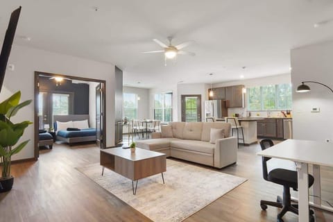 Relax in style amidst tasteful decor and ample light. Our cozy living room offers comfort and chic design for your perfect retreat.