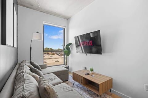 Relax in style amidst tasteful decor and ample light. Our cozy living room offers comfort and chic design for your perfect retreat.