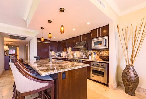 Stylish kitchen with granite counters and pendant lighting, designed for both chefs and casual grazers. HKK-450