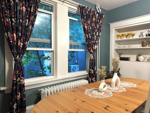 Inviting dining space with a sunlit window, creating a cheerful atmosphere 