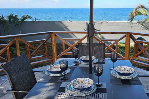 Enjoy outdoor meals on the deck while enjoying views of the Caribbean Sea.