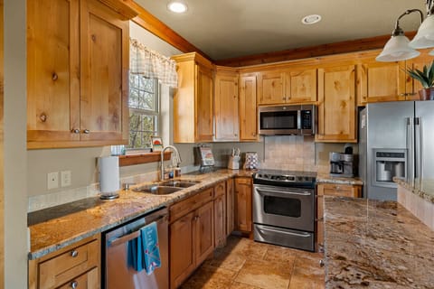 Spacious Kitchen | Granite Countertops | Stainless Steel Appliances | Warm Wood Cabinetry