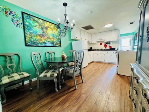 Bright and open dining space with a view into the fully equipped kitchen — perfect for shared meals, morning coffee, or a cozy night in. ️☕ Everything you need is just steps away!