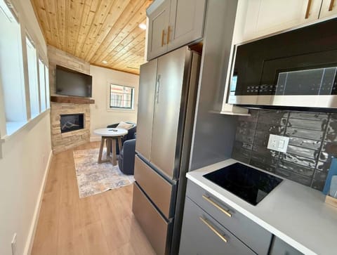 Beautiful backsplash stacked tile with a peek-a-boo view of the living room.