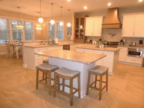 Kitchen opens up to great room and dining area for 10