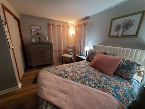 The full bedroom has a double closet, 2 windows,a dresser and 2 end tables. 