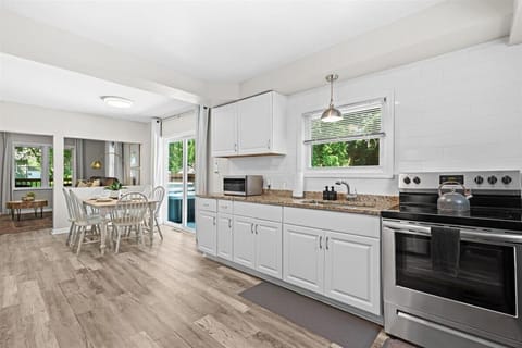 Open kitchen and dining area designed for gathering and entertaining
