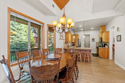 The kitchen is open to the dining area. It is a great space to visit while preparing meals.
