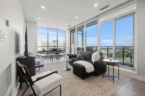 Bright penthouse living: relax in comfort with breathtaking city views.