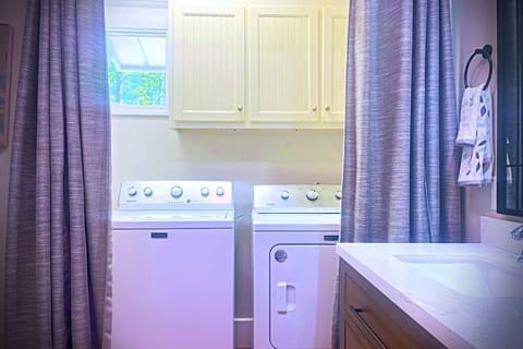 The main bathroom has a full size washer and dryer.