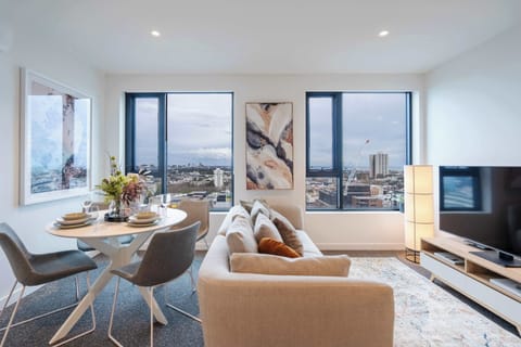 Spacious living room with views of the bay and city