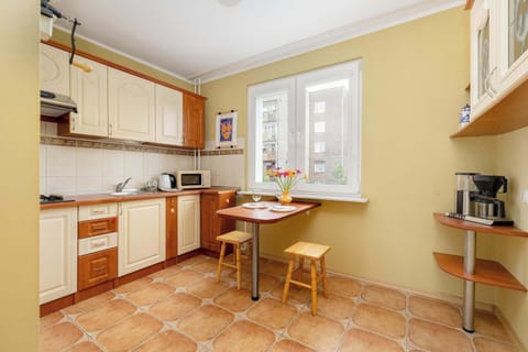 A spacious kitchen with light cabinets and full equipment is perfect for cooking your favourite dishes.