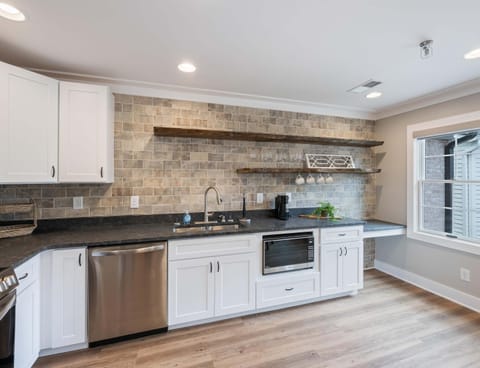 The airy kitchen is well-equipped for an unforgettable getaway​