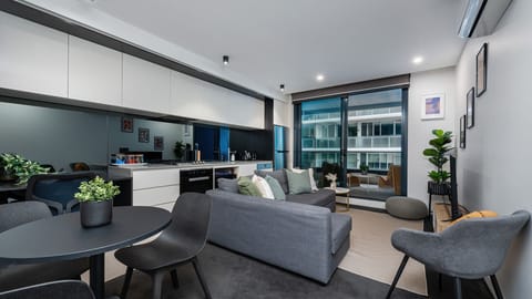 Open plan living with large glass doors to balcony
