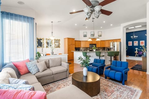 Relax in the open living room with a 65" TV that has all the streaming services!