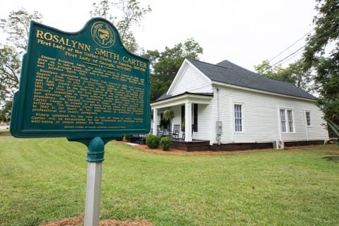 Front/right side of home with the historical marker in the yard near the road. 