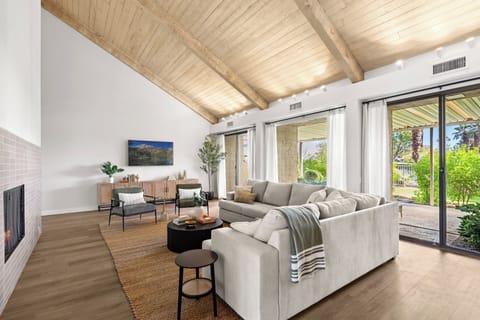 Spacious living room we tons of natural light, fireplace and bar