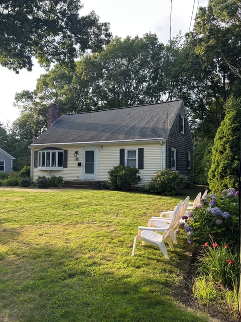 Enjoy views of sunset over the water from the front lawn Adirondack chairs. 