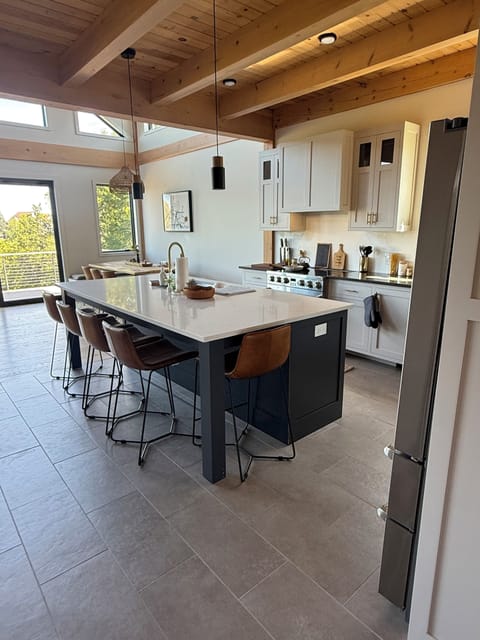 Our open kitchen with an oversized island that seats up to 5