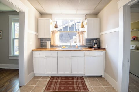 Modern kitchen with stainless steel appliances and sleek countertops.
