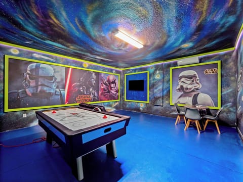 Action Packed Star Wars Themed Game Room Including Air Hockey and Lounge Area