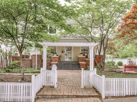 Experience the perfect blend of classic charm and modern comfort. Our inviting front porch, with its stylish brick details and ambient lighting, is the ideal spot to unwind after a day of exploring.