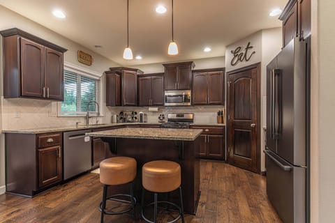 A chef’s delight, the kitchen offers expansive counters and modern appliances, making it easy to prepare meals and gather with friends or family.