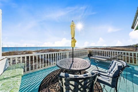 Your private beachfront deck offers stunning ocean views with comfortable seating for morning coffee or sunset cocktails.
