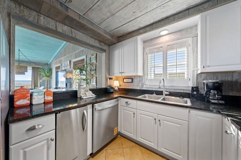 Your fully equipped kitchen features granite counters and stainless appliances, perfect for creating memorable meals during your stay.