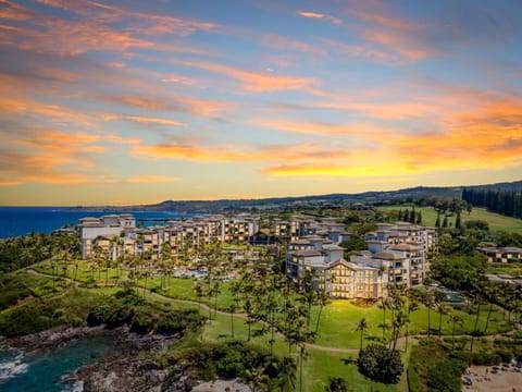 Witness stunning Maui sunsets above our oceanfront resort, where golden skies meet lush tropical paradise
