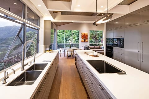 Custom-designed kitchen with dual sinks and panoramic views—perfect for group meals or private chefs.
