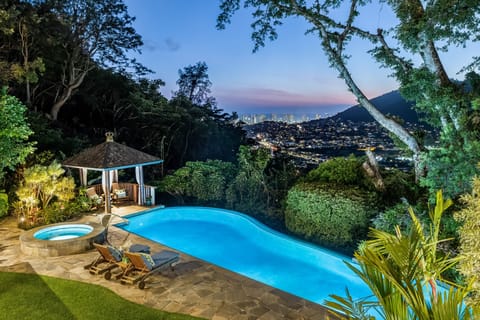 Swim above the city in this serene infinity pool with breathtaking views of Honolulu and beyond.