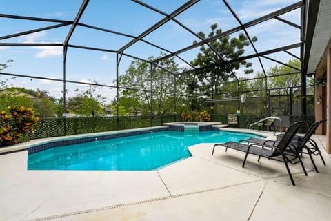 PATIO:  Private Screened South Facing Swimming Pool & Spa with 2 Chaise Lounges and 2-Seat Round Bistro Table