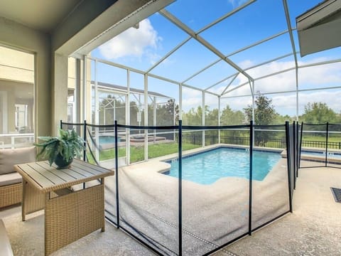 Relax by the private screened pool with scenic views and plenty of sunshine.