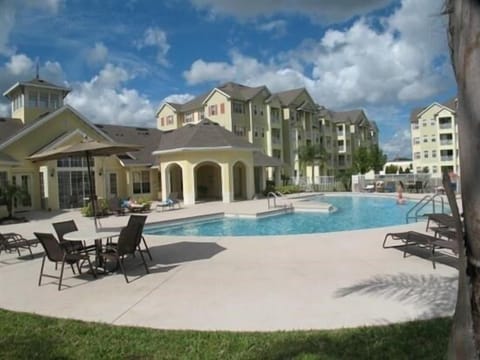 Relax by the sparkling pool with lounge chairs and scenic views of the property.