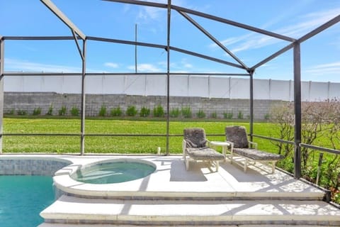 Soak up the sun or unwind in the spa, overlooking a peaceful backyard.