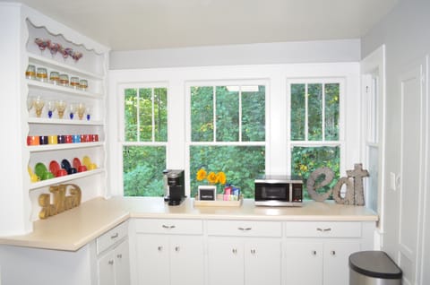 Kitchen cabinet, window, coffee machine