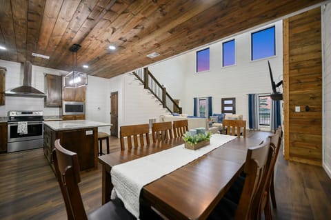 Spacious rustic-modern kitchen & dining—warm, social spot for family gatherings.