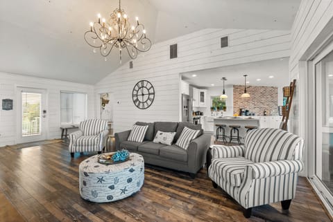 Stylish space featuring ocean views, elegant decor, and ample seating 