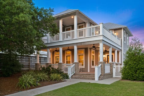 Welcoming entryway with a large covered porch and Southern-style architecture.