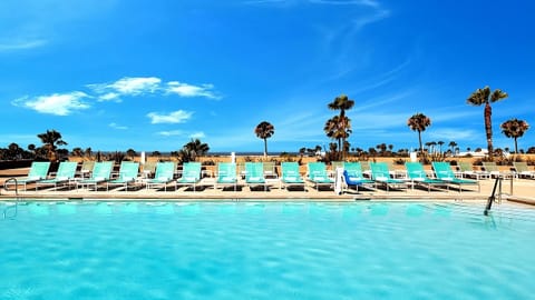 Cool off with a serene swim beneath big blue skies.