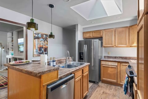 Full kitchen with spacious countertops, stainless appliances, and modern open layout.