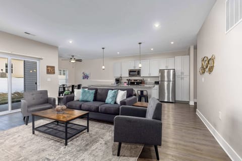 Comfortable living room with cozy seating and a sofa bed— perfect for relaxing after a day out.