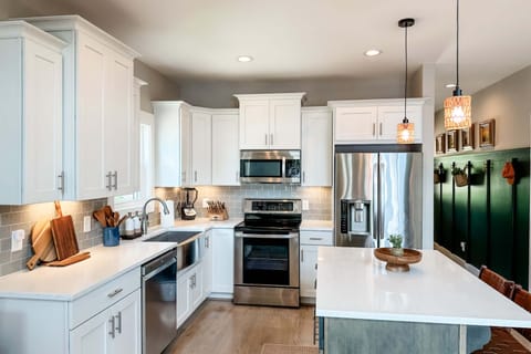 Kitchen with all stainless steel appliances and all the gadgets you may need to cook a delicious meal. 
