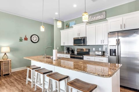 The open, airy kitchen offers ample space & every home comfort​