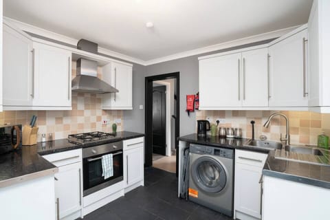 Fully equipped kitchen with modern appliances for easy home cooking