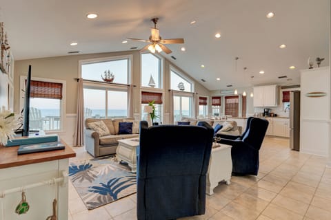 This view greets you on the top floor. Living room, dining area, kitchen & bed 4
