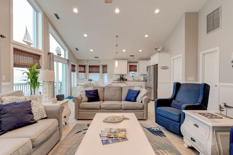 Living room, dining area, kitchen all leading to the oceanfront deck.