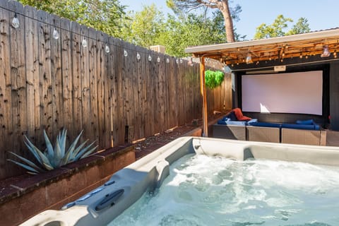 Private Back Yard: Features outdoor theater area and relaxing hot tub