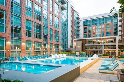 Stretch out on stylish loungers steps from sparkling blue water.